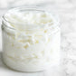 Vanilla Sandalwood Whipped Body Butter in a jar, showcasing its creamy texture and luxurious formulation. Enriched with nourishing ingredients for deep hydration and a soothing vanilla and sandalwood scent.