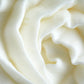 Close-up of Vanilla Sandalwood Whipped Body Butter in a jar, highlighting its rich, creamy consistency. Formulated with moisturising ingredients to provide soft, smooth skin with a warm, calming fragrance.
