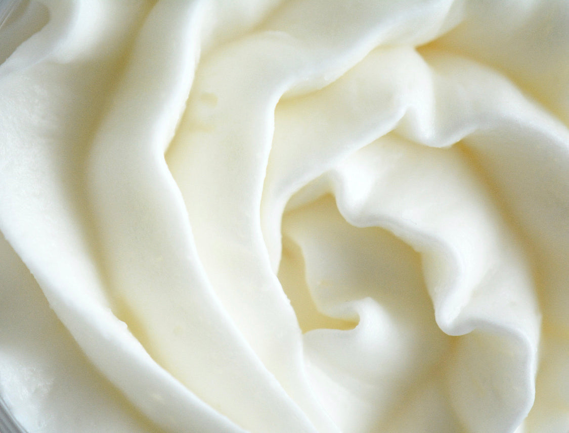 Close-up of Vanilla Sandalwood Whipped Body Butter in a jar, highlighting its rich, creamy consistency. Formulated with moisturising ingredients to provide soft, smooth skin with a warm, calming fragrance.